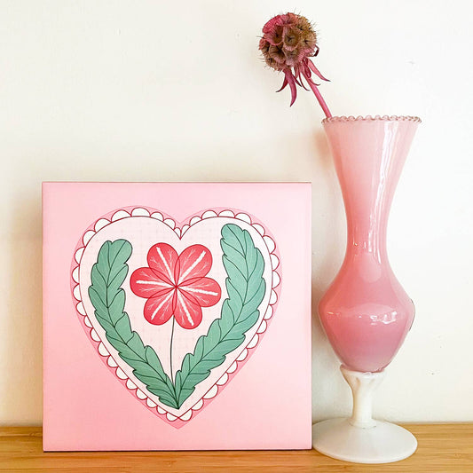 Decorative tile with heart and flower: Tile with hanging eye
